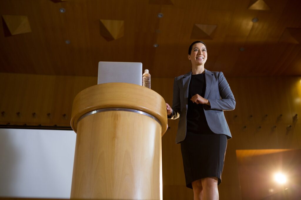Female business executive giving a speech